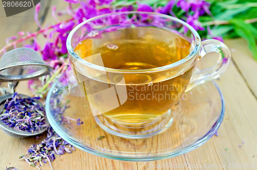 Image of Herbal tea from fireweed in cup with strainer