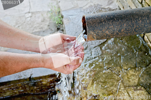 Image of Water spring with hands