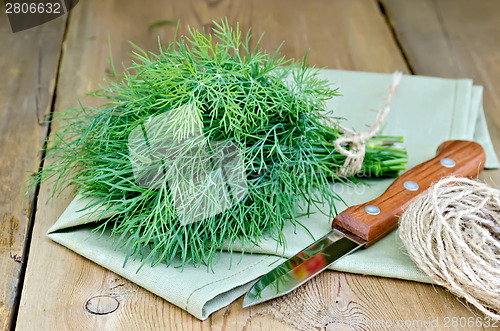 Image of Dill with napkin and twine on board
