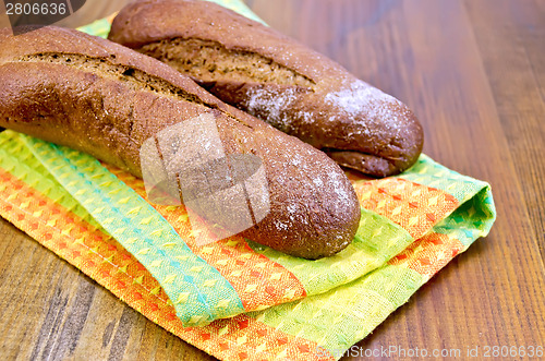 Image of Rye baguettes on a napkin and board