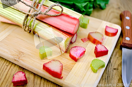 Image of Rhubarb cut and knife on board