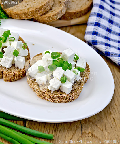 Image of Bread with feta and chives on a plate