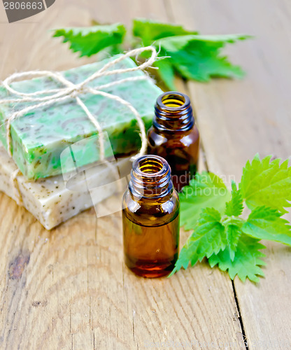 Image of Oil and soap on board with nettle
