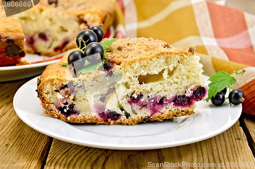 Image of Pie with black currant on board with napkin