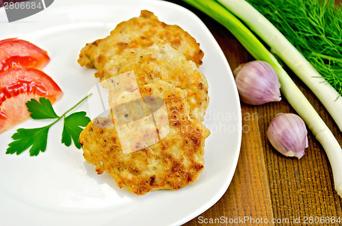 Image of Fritters chicken with green onions on board