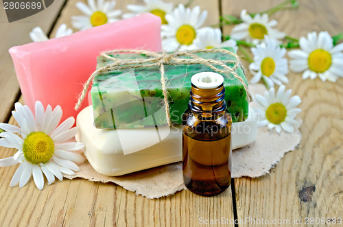 Image of Oil with soap and camomile on board