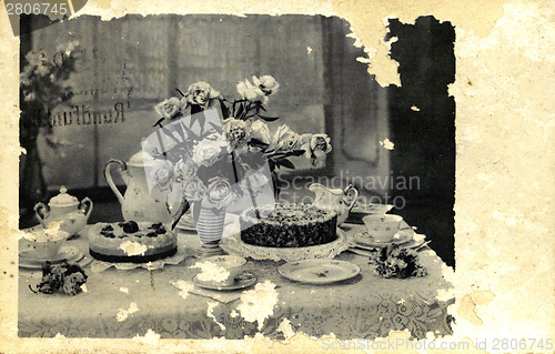 Image of Vintage card with flowers in a vase and a cake