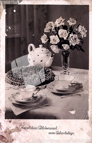 Image of Vintage card with flowers in a vase