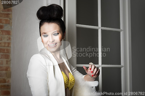 Image of Beautiful elegant woman flirting and laughing