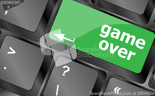 Image of Computer keyboard with game over key - technology background,
