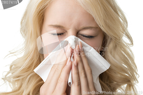 Image of Ill woman with tissue is sneezing