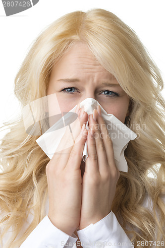 Image of Ill woman with tissue is sneezing