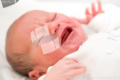 Image of crying newborn baby in the hospital