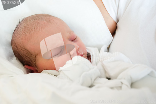 Image of sleeping newborn baby in the hospital