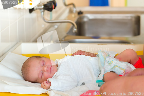 Image of sleeping newborn baby in the hospital