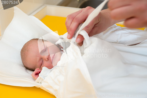 Image of sleeping newborn baby in the hospital