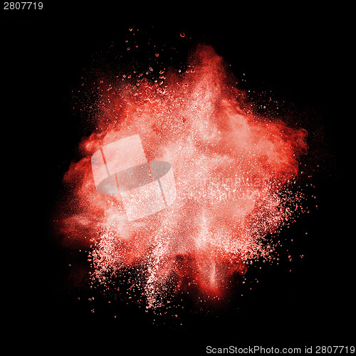 Image of Red powder explosion isolated on black