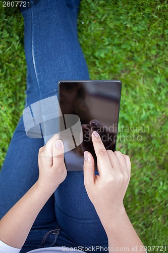 Image of Woman using digital tablet PC