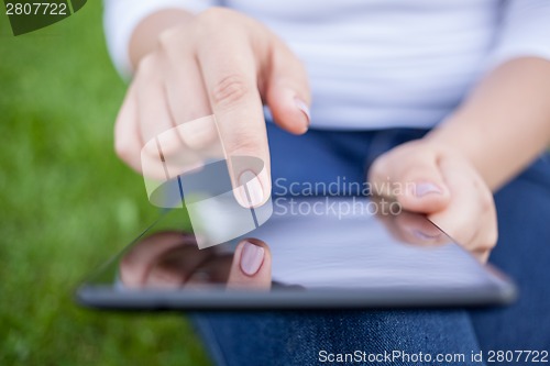 Image of Woman using digital tablet PC