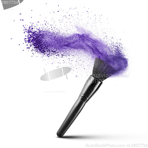 Image of makup brush with blue powder isolated