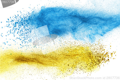 Image of Blue and yellow powder explosion isolated
