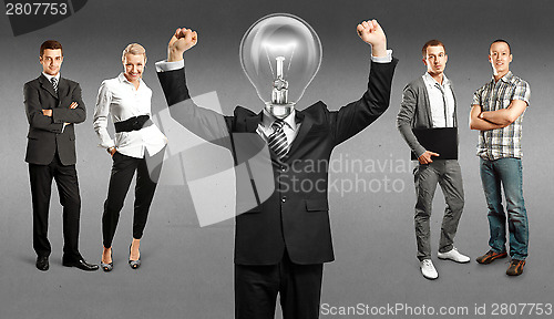 Image of Business Team With Lamp Head