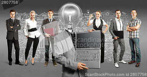 Image of Business Team With Lamp Head