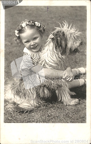 Image of Young adorable girl on the vintage postcard from 1911