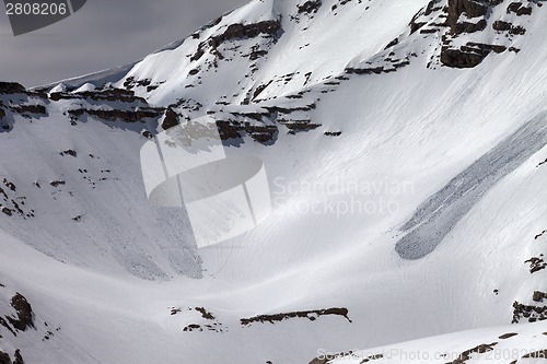 Image of Mountains with snow cornice and traces from avalanches