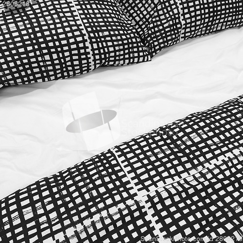 Image of Black and white bed linen with pillows