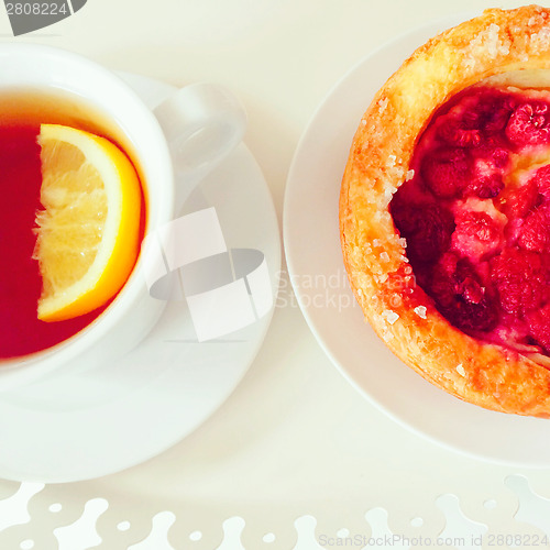 Image of Raspberry pastry and cup of tea