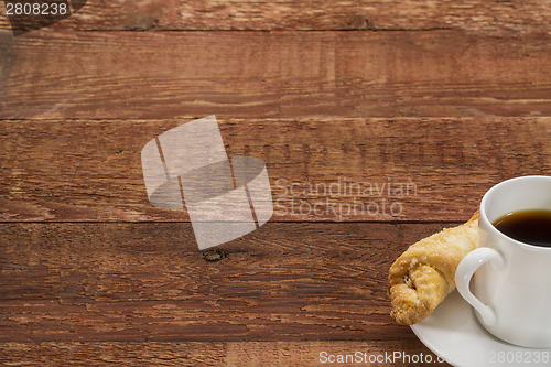 Image of coffee on a rustic wooden table