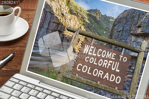 Image of Colorado welcome sign on laptop