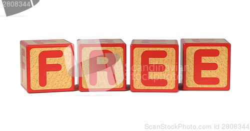 Image of Free on Colored Wooden Childrens Alphabet Block.