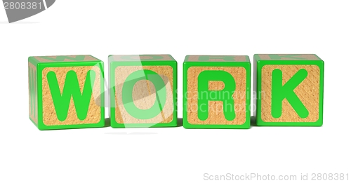Image of Work on Colored Wooden Childrens Alphabet Block.