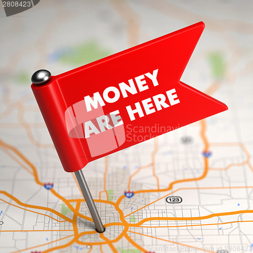 Image of Money Are Here - Small Flag on a Map Background.