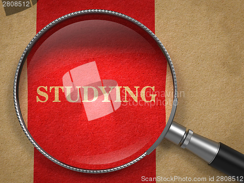 Image of Studying Concept Through Magnifying Glass.