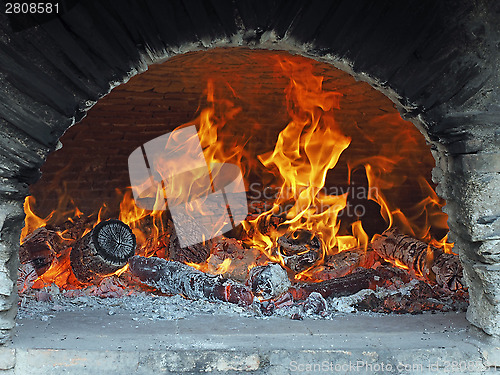 Image of wood fire in a bread oven