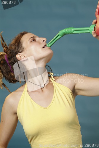 Image of woman drinks of jerry can
