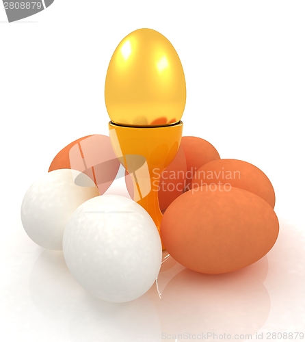 Image of Eggs and gold easter egg on egg cups 