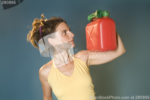 Image of woman looks at petrol can