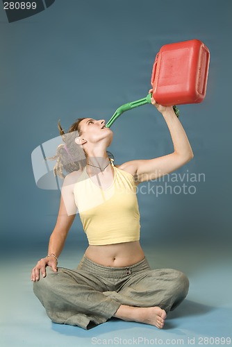 Image of woman drinks of jerry can
