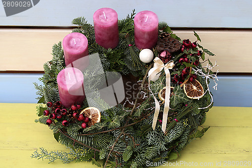 Image of Christmas wreath with pink candles