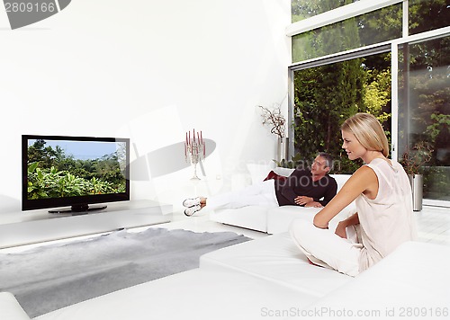 Image of Beautiful Couple Watching TV