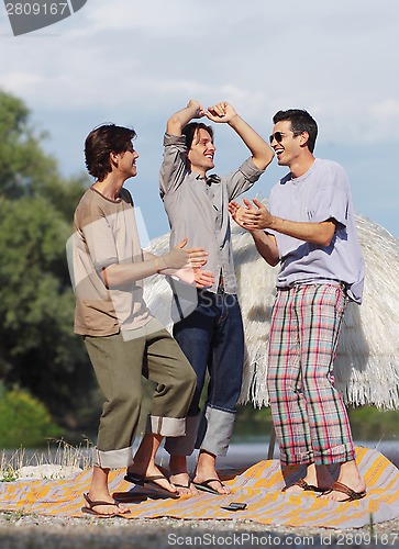 Image of friends having fun at the beach