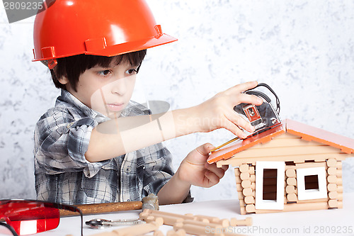 Image of boy built a new house