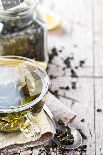 Image of cup of green tea and lemon