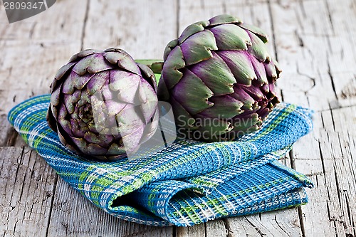 Image of two fresh artichokes