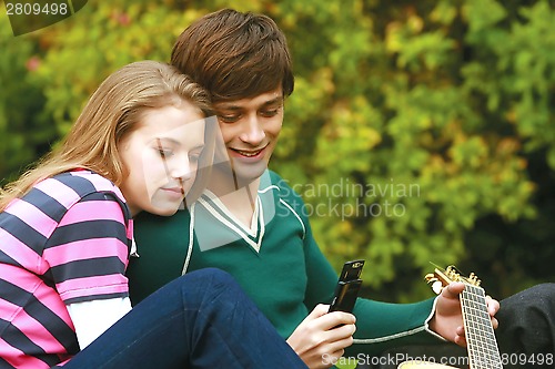 Image of Romantic young couple relaxing