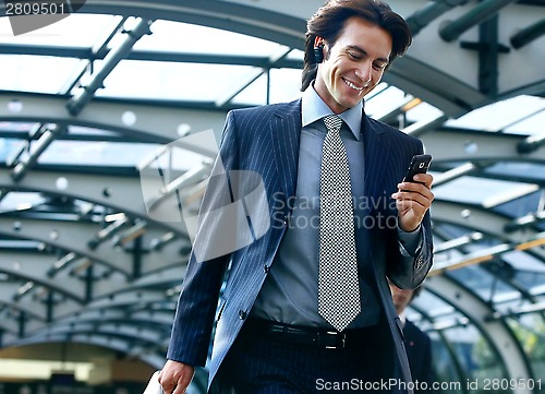 Image of talking on mobile phone in subway